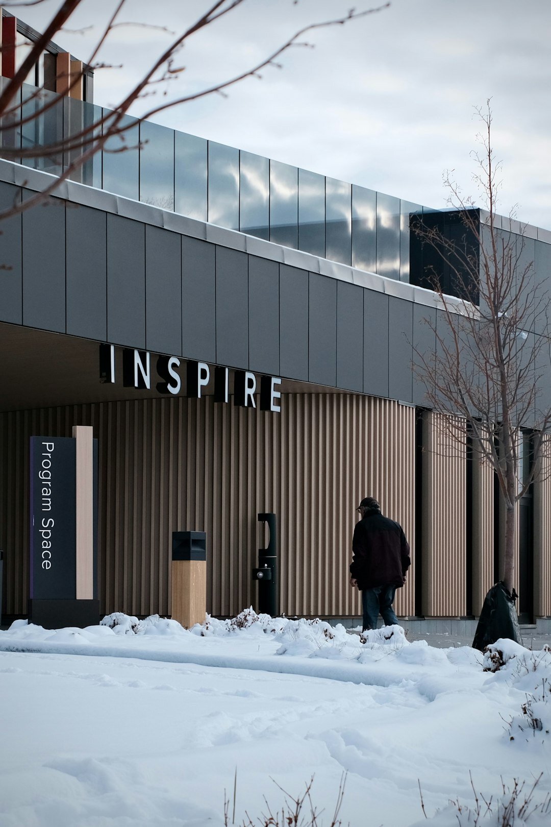 Group of seniors standing outside a community center building