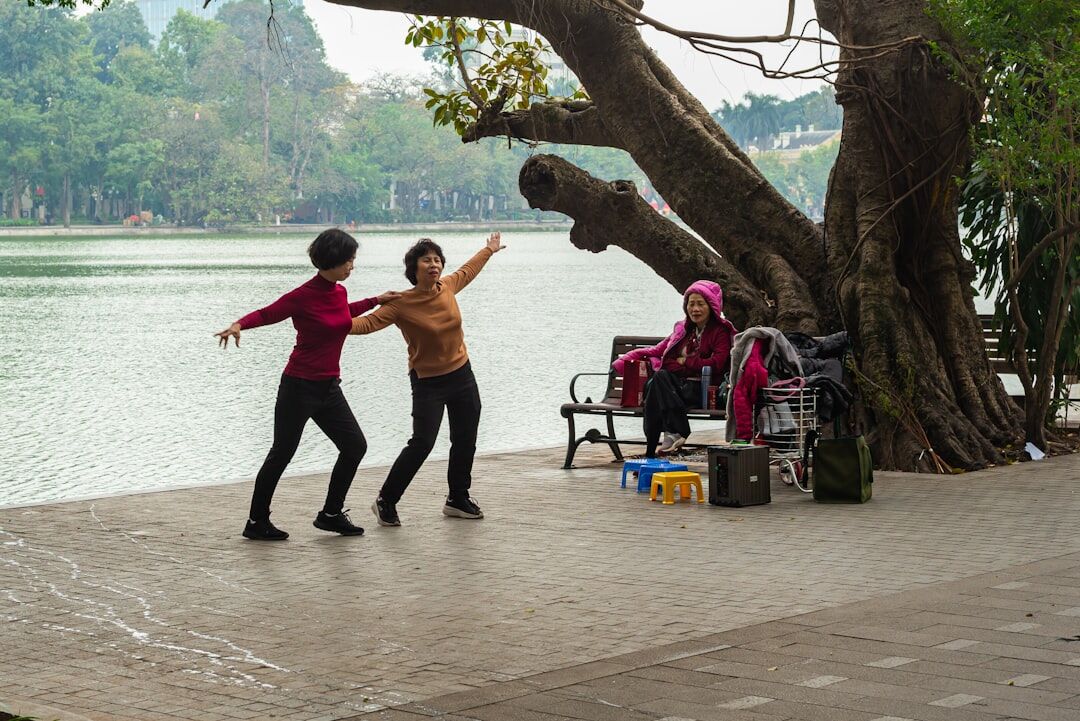 Group of senior citizens dancing together in a community hall